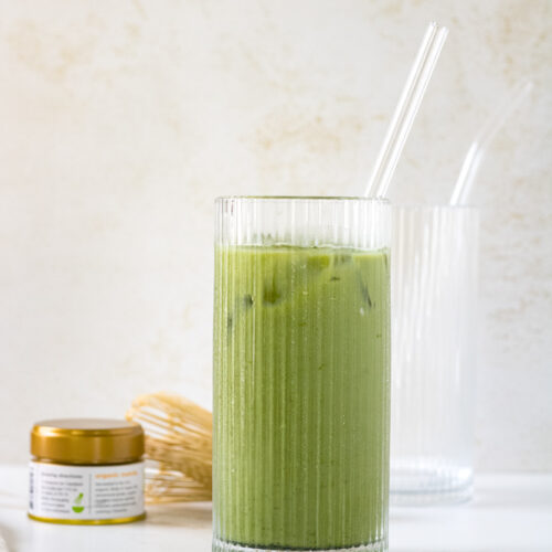 Side view of iced matcha latte with vanilla.
