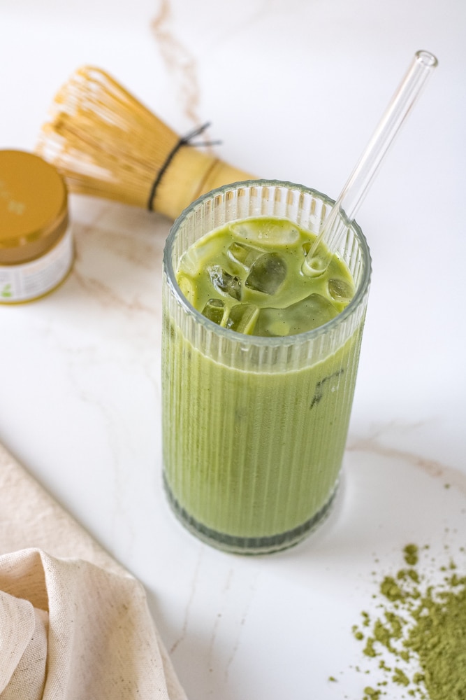¾ image of iced matcha in a glass.