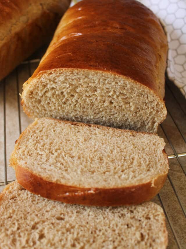 Close up on sliced honey whole wheat bread.