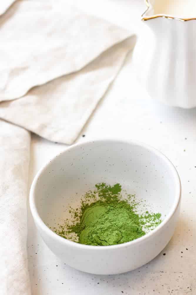 Matcha powder in a small bowl. 