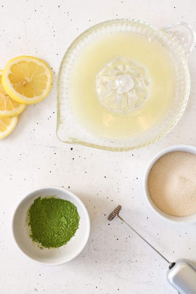 Overhead image of matcha lemonade on a table.