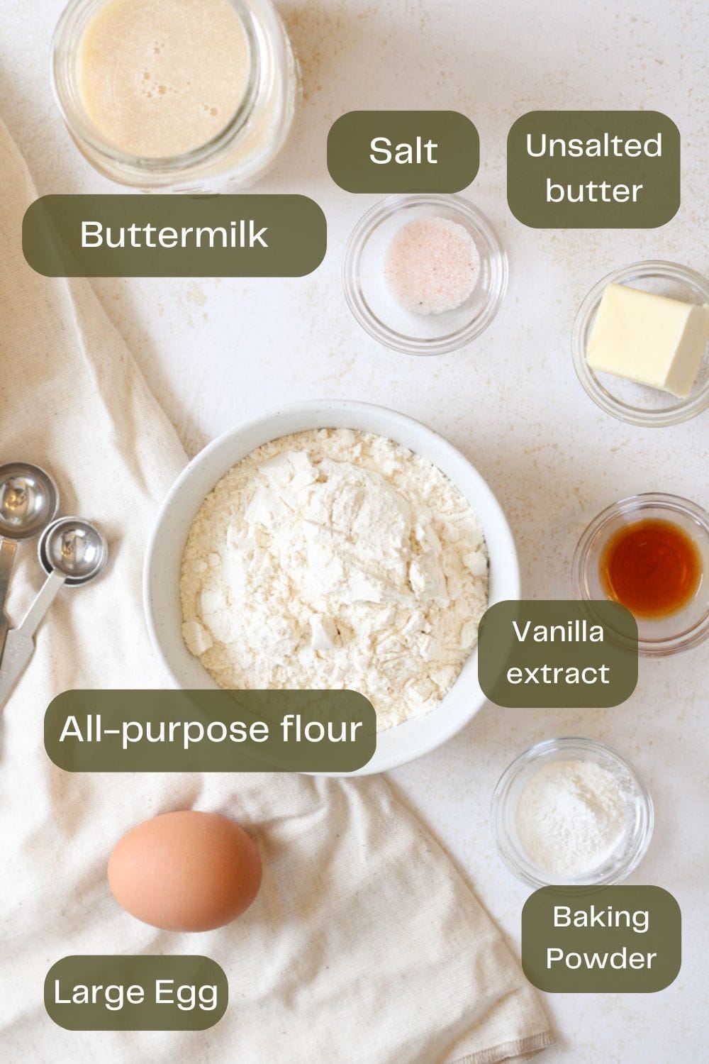 Overhead ingredient image of buttermilk pancake ingredients.