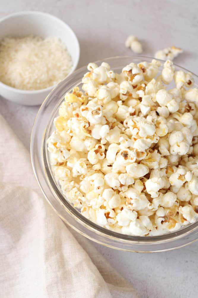 3/4 view of a bowl of parmesan cheese popcorn.
