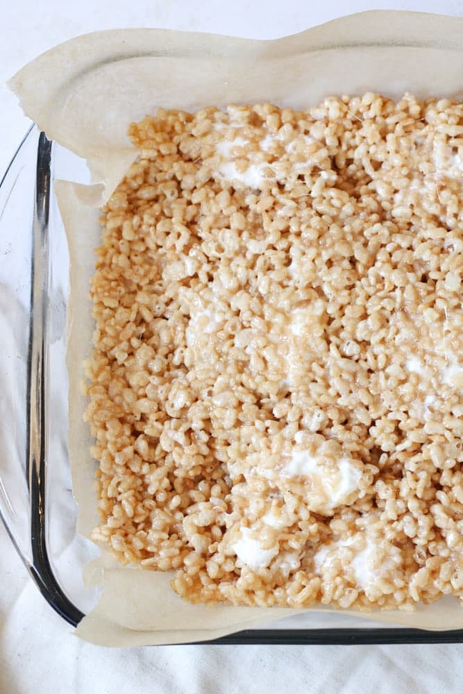 Overhead view of rice krispie treats in a baking dish.
