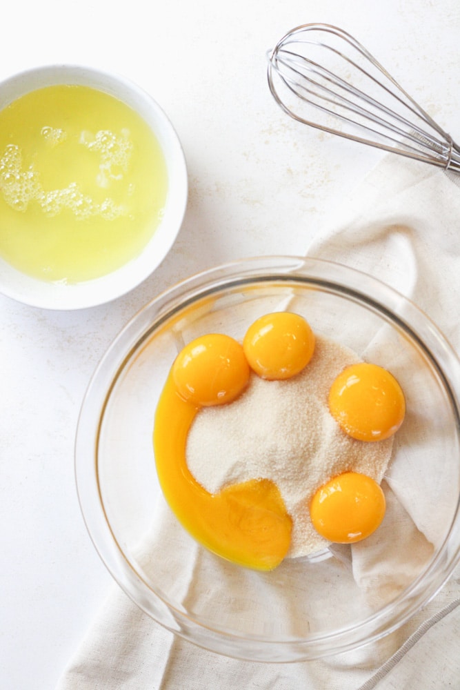 Large bowl with sugar and egg yolks. 