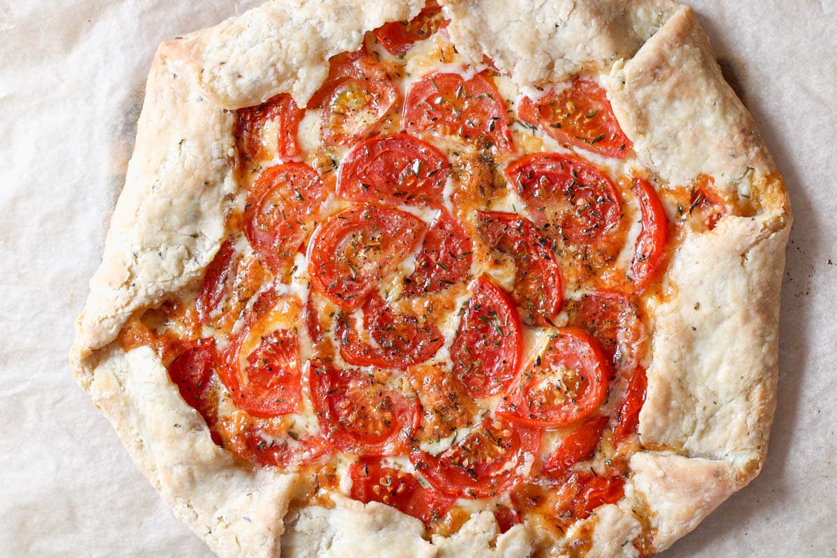 Overhead image of a savory tomato tart.