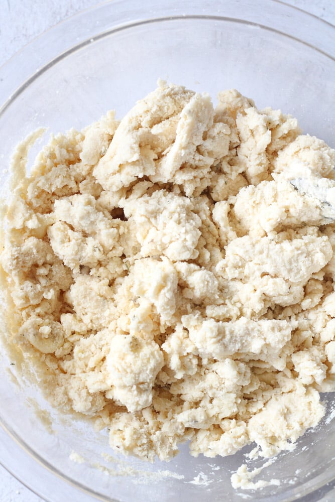 Pastry dough in a bowl mixed with water.