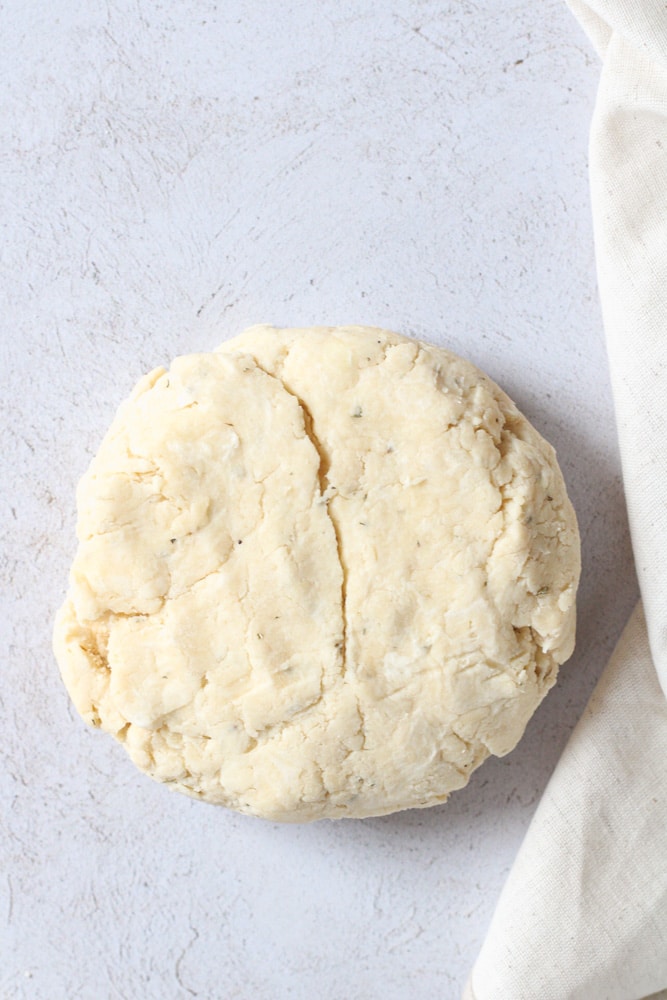 Pastry dough ball on a counter.