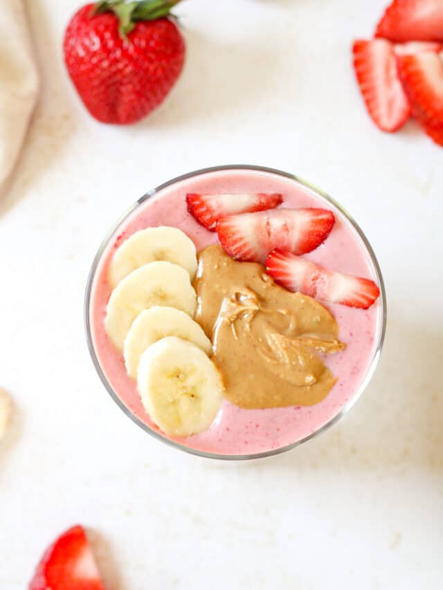Overhead image of strawberry smoothie with toppings.