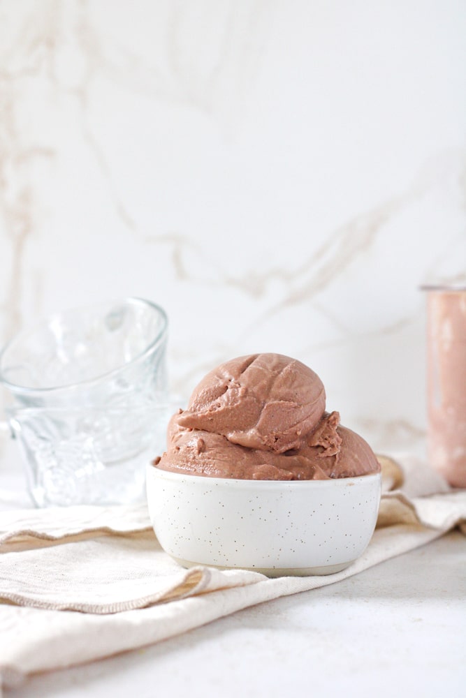Side view of chocolate ice cream in a bowl.