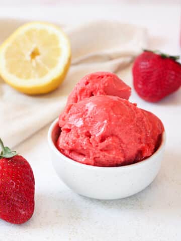 Close up image of strawberry sorbet in a bowl.