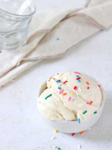 Ninja creami vanilla ice cream in a bowl with sprinkles.