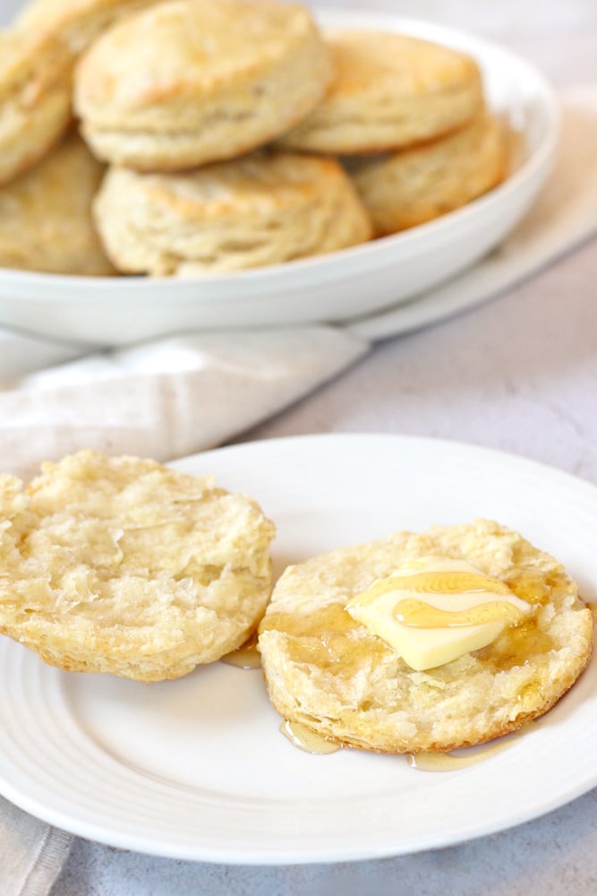 Sliced biscuit with butter and honey,