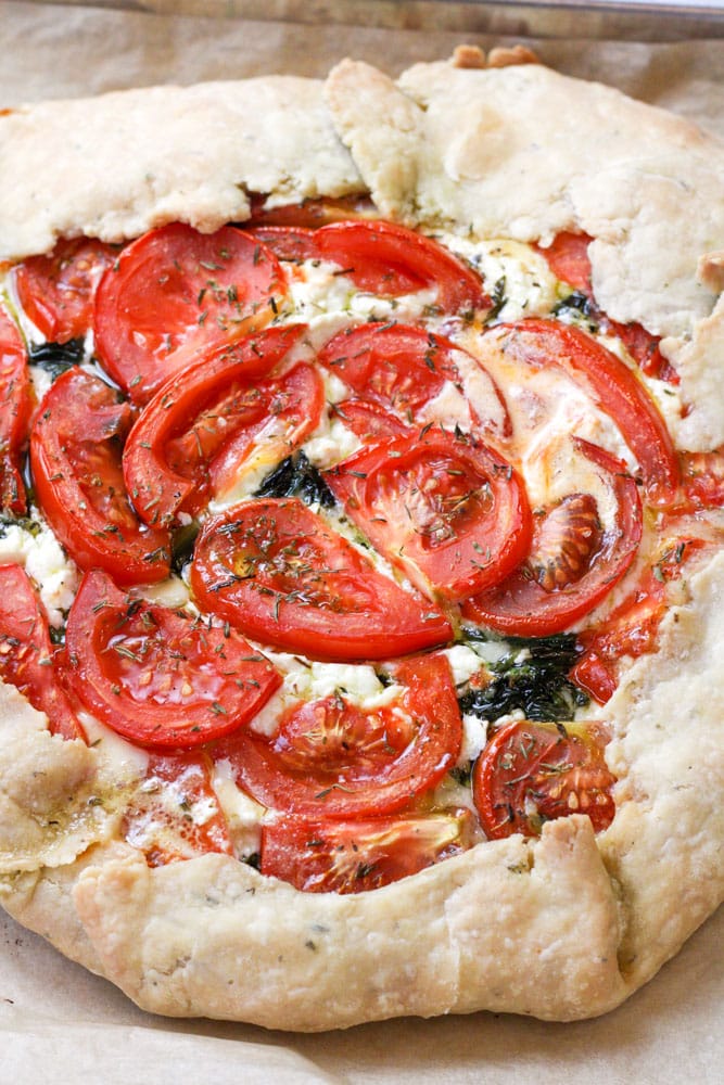 Close up view of the side of a tomato tart.