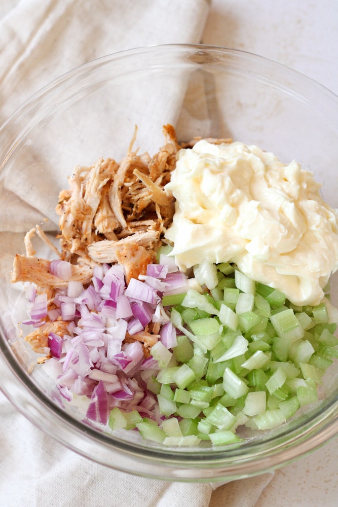 Chicken salad ingredients a bowl.