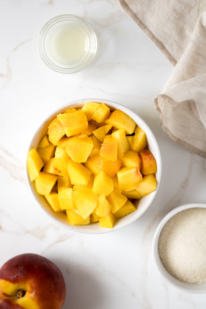 Chopped peaches in a bowl ready to use for sorbet.