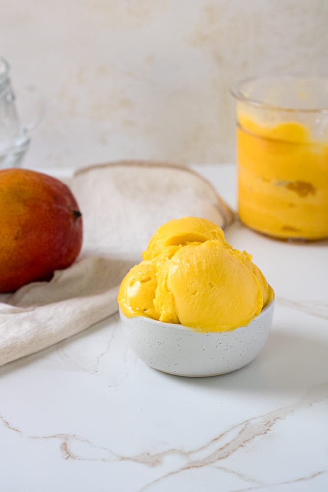 Side view of scoops of sorbet in a bowl.