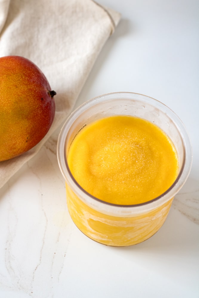 Close up image of frozen sorbet base in a container.