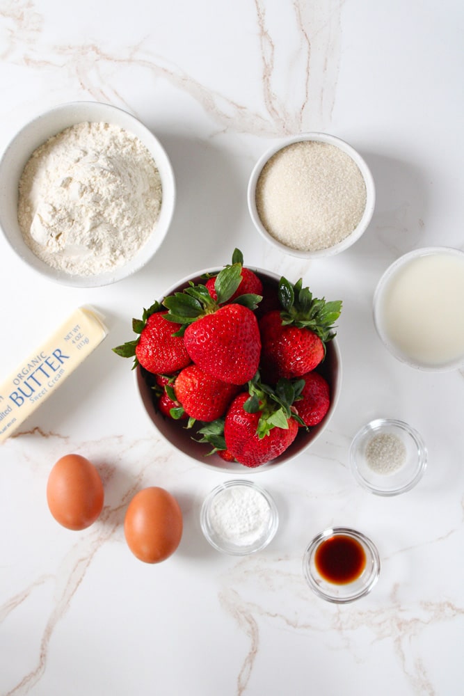 Strawberry muffins ingredients on a table.