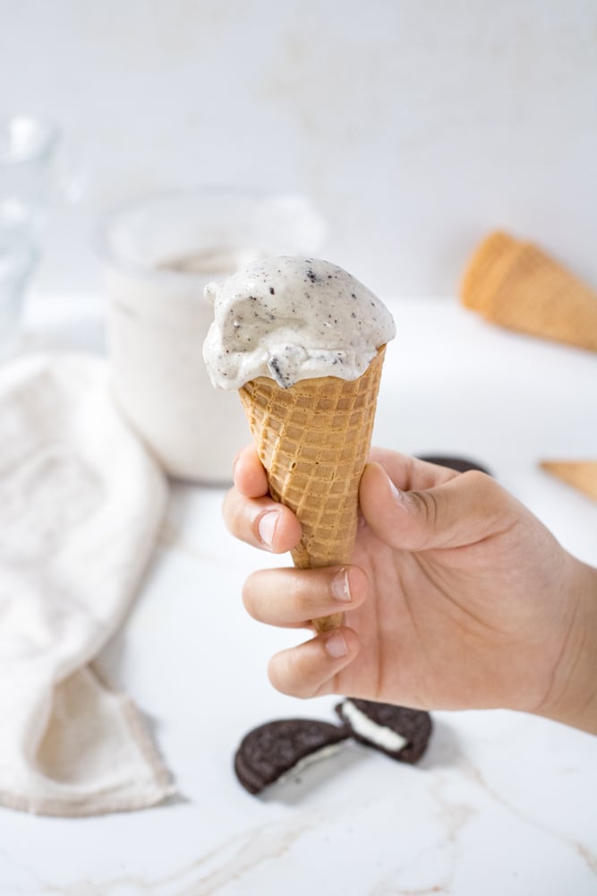 ¾ image of oreo ice cream in an ice cream cone.