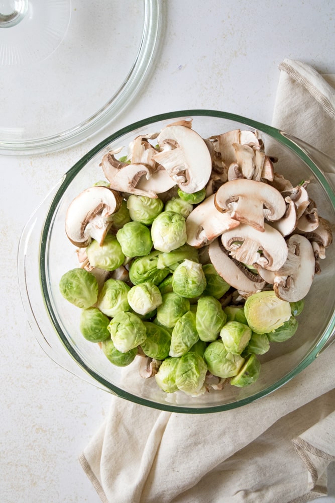 Overhead image of chopped vegetables in a baking dish.