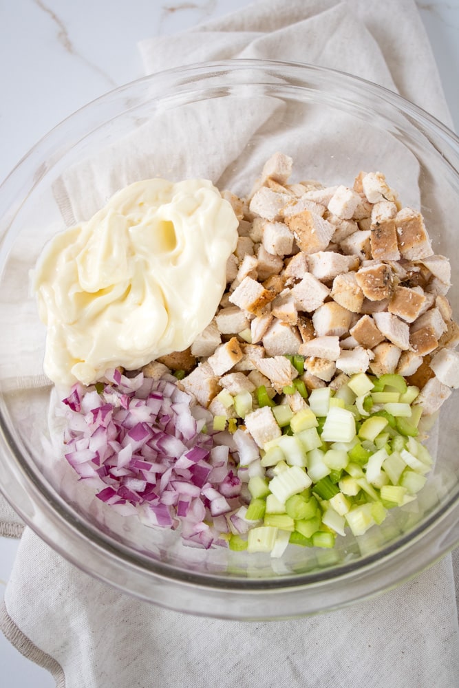 Chicken salad ingredients a bowl.