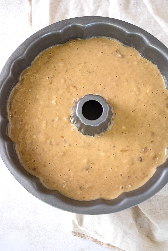 Banana bread batter in a bundt cake pan.