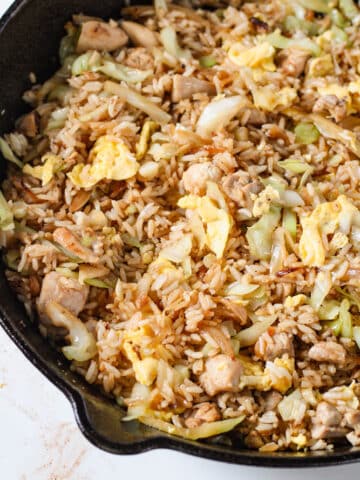 Fried rice with cabbage, chicken, and scrambled eggs.