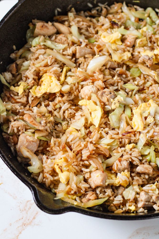 Fried rice with cabbage, chicken, and scrambled eggs.