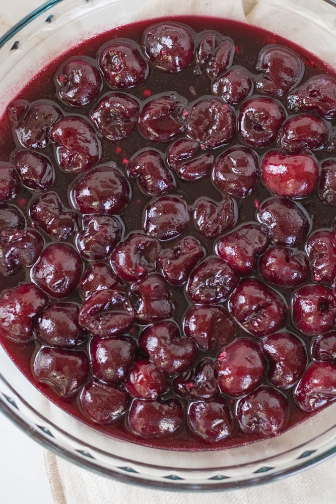 Cherry pie filling in a pie pan. 