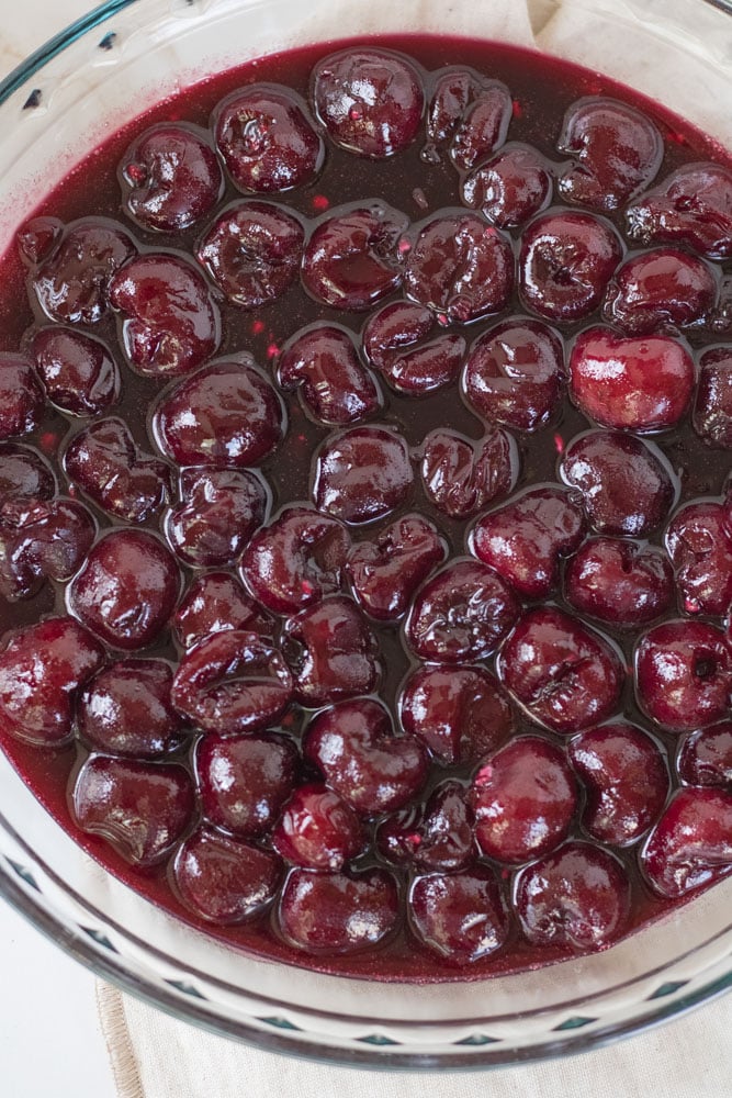 Cherry pie filling in a pie pan.