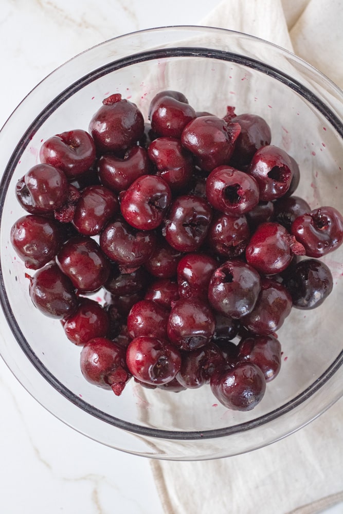 Pitted cherries in a bowl.