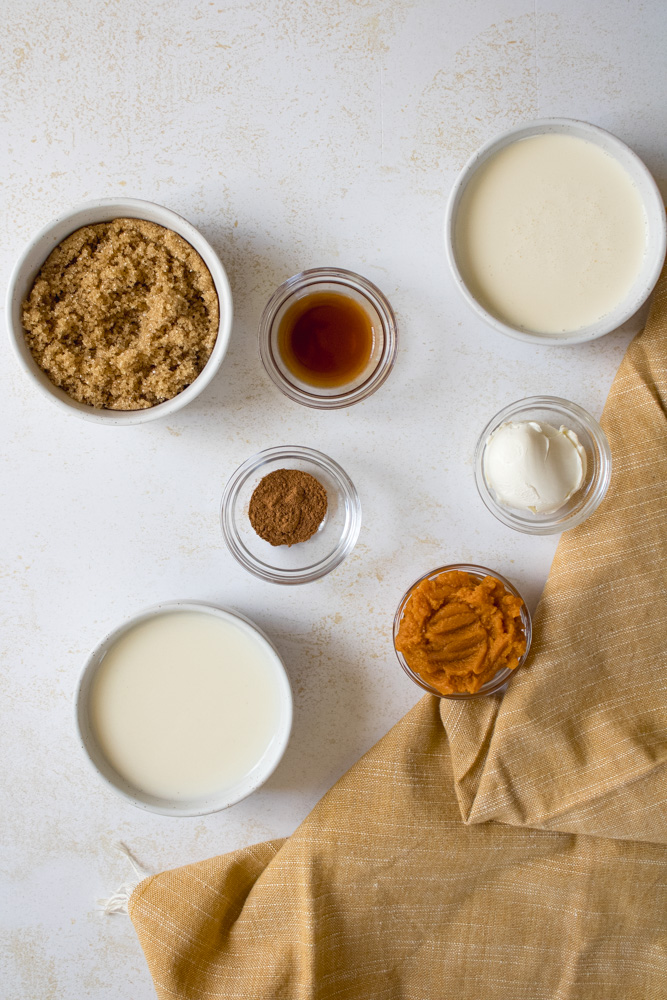 Overhead image of pumpkin spice ice cream ingredients on a table.