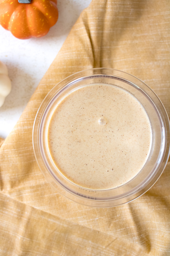 Ice cream base in a ninja creami pint container.