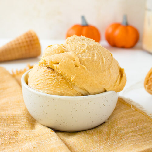 Scoops of Ninja creami pumpkin ice cream in a bowl.