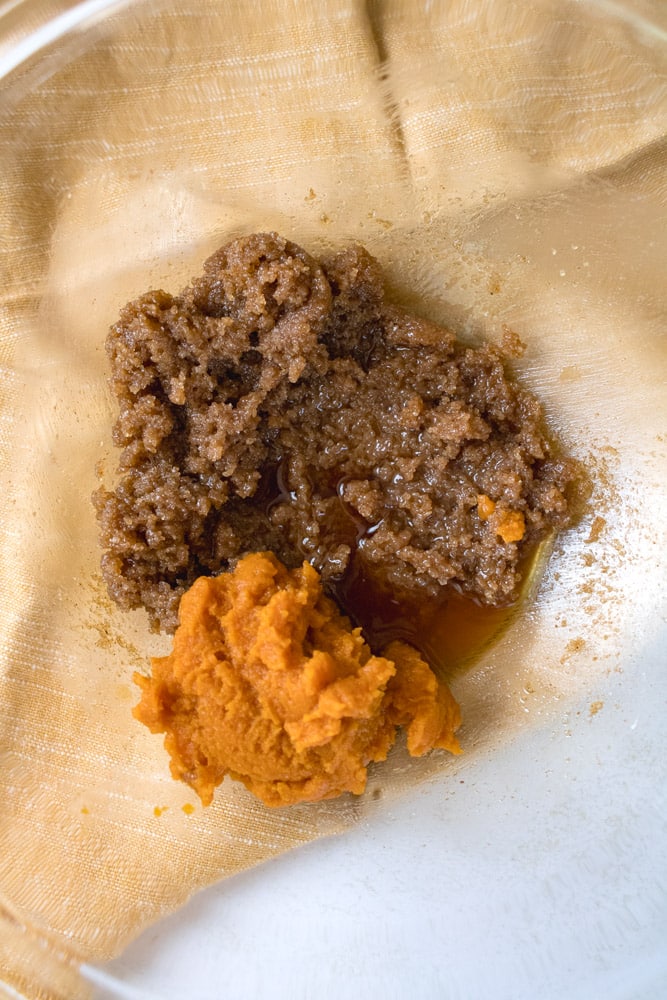 Brown sugar in a bowl with pumpkin puree.