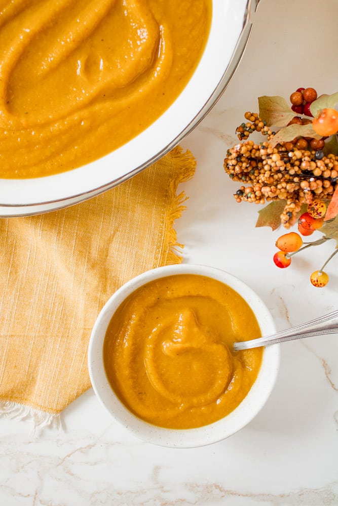 Overhead image of roasted butternut squash soup in a bowl.