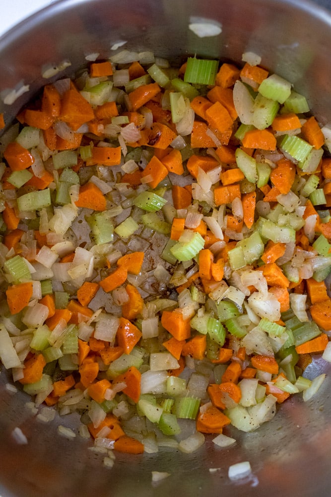 Sauteed veggies in a pot.