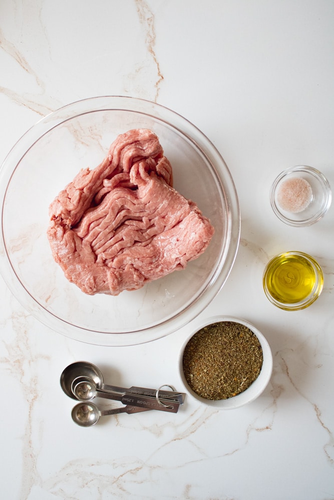 Overhead image of turkey sausage ingredients on a table.