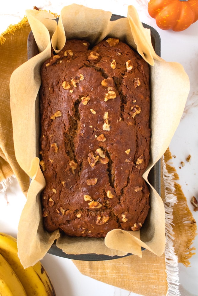 Overhead image of banana bread in a metal loaf pan.
