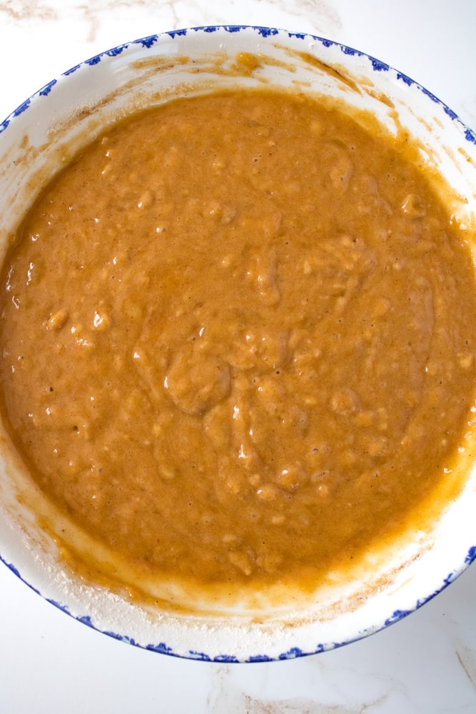 Pumpkin bread batter in a large mixing bowl.