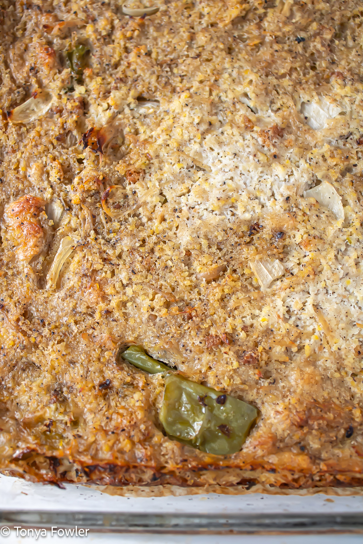 Close up image of baked dressing in a baking dish.