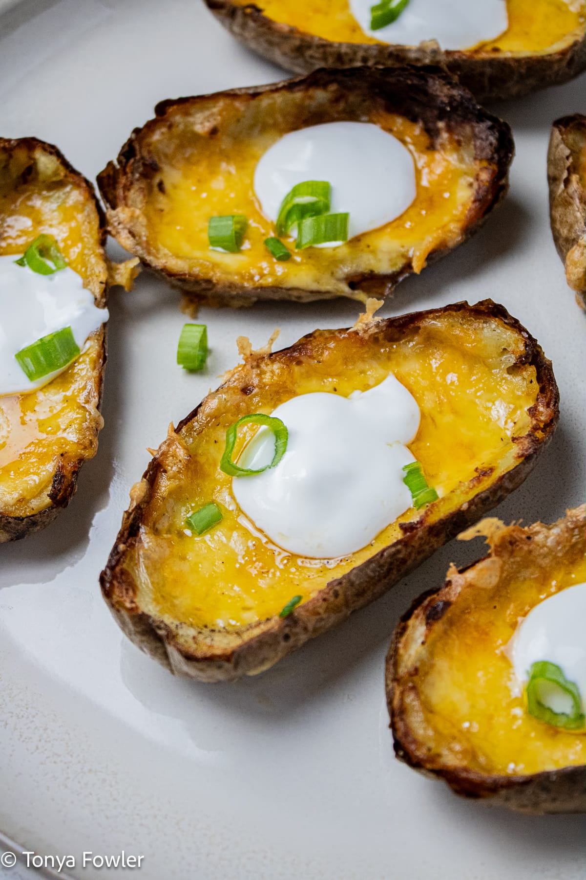 Close up image of potato skins on a plate.