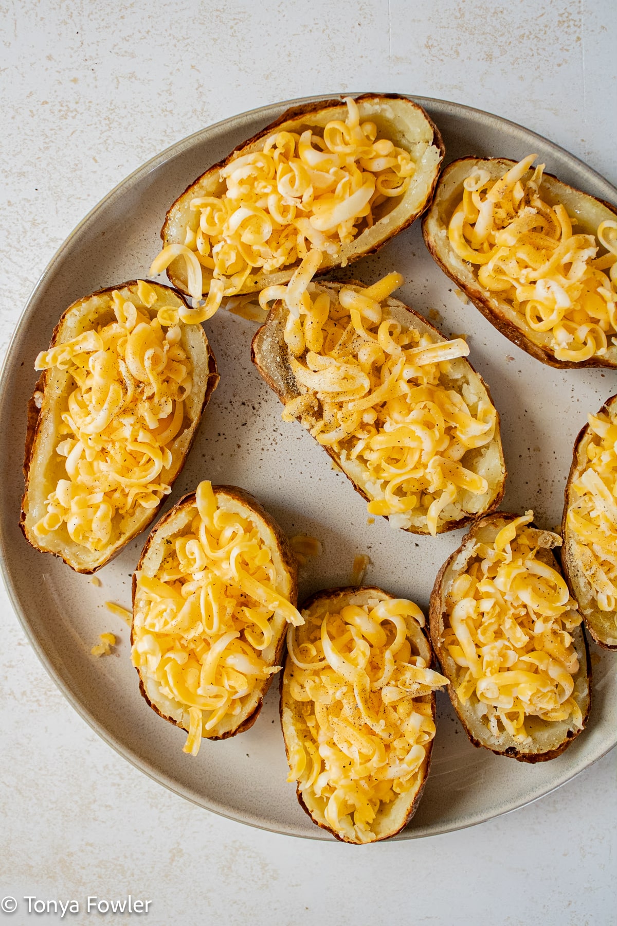 Potato skins filled with cheese.