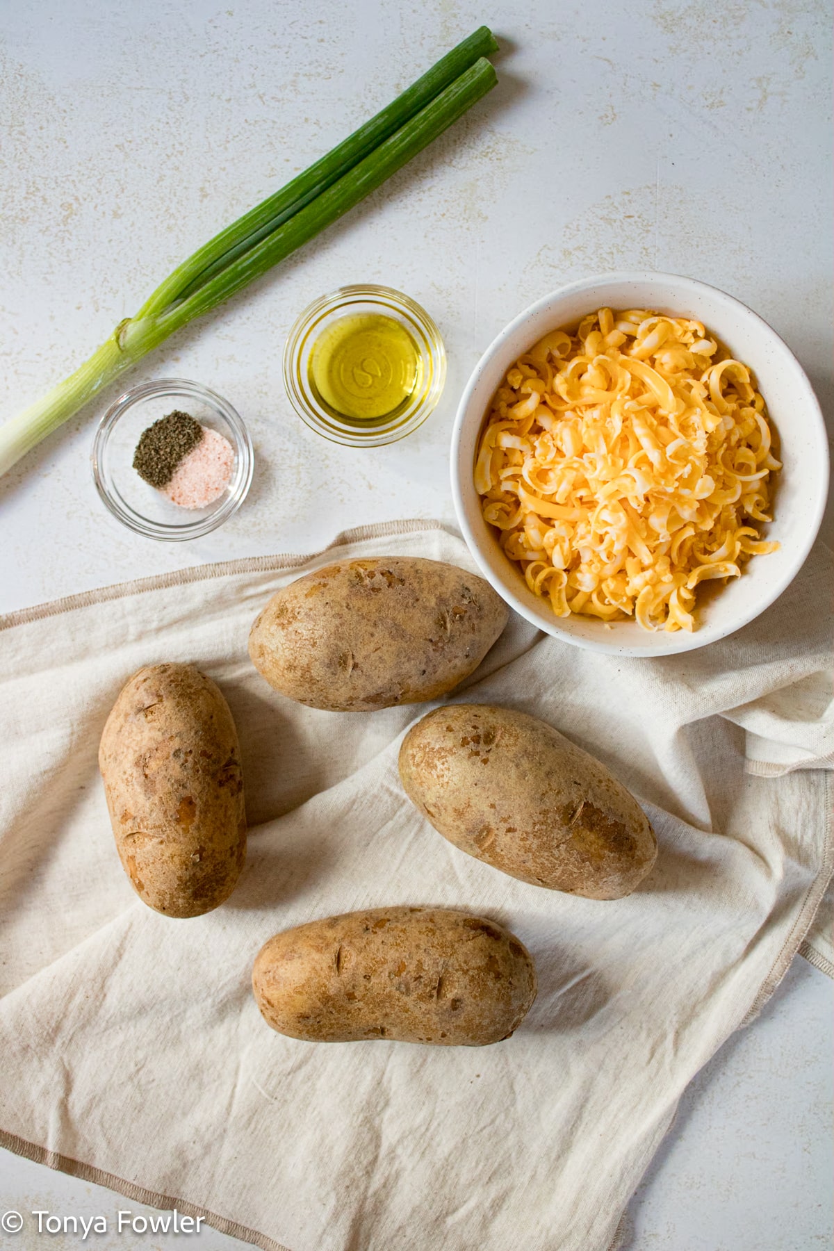 Potato skins ingredients on a table. 