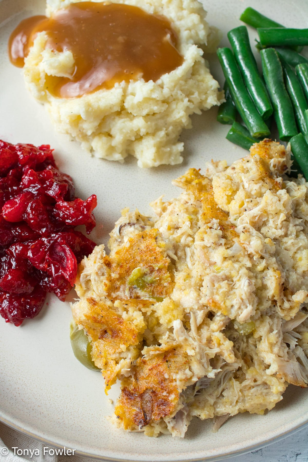 Cornbread dressing on a plate.