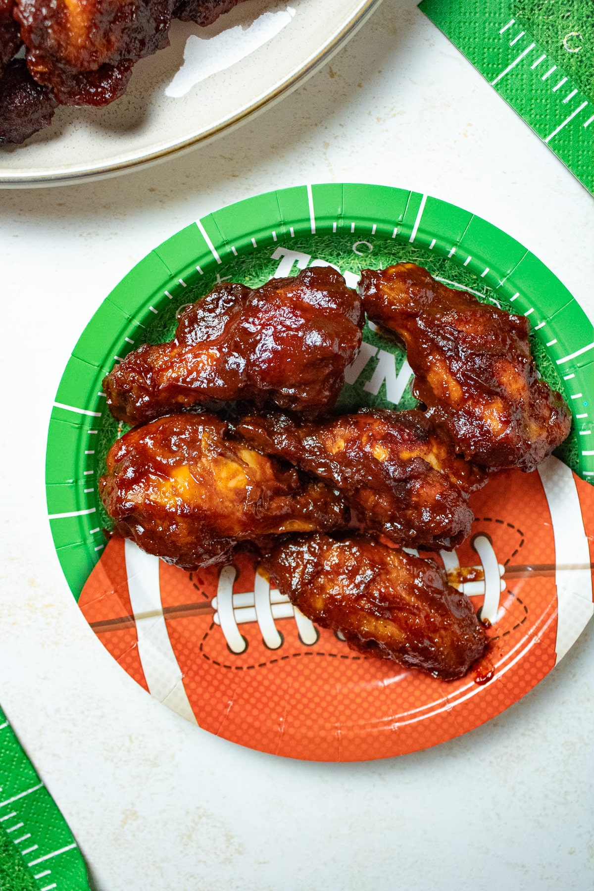 Air fryer wings on a football plate.