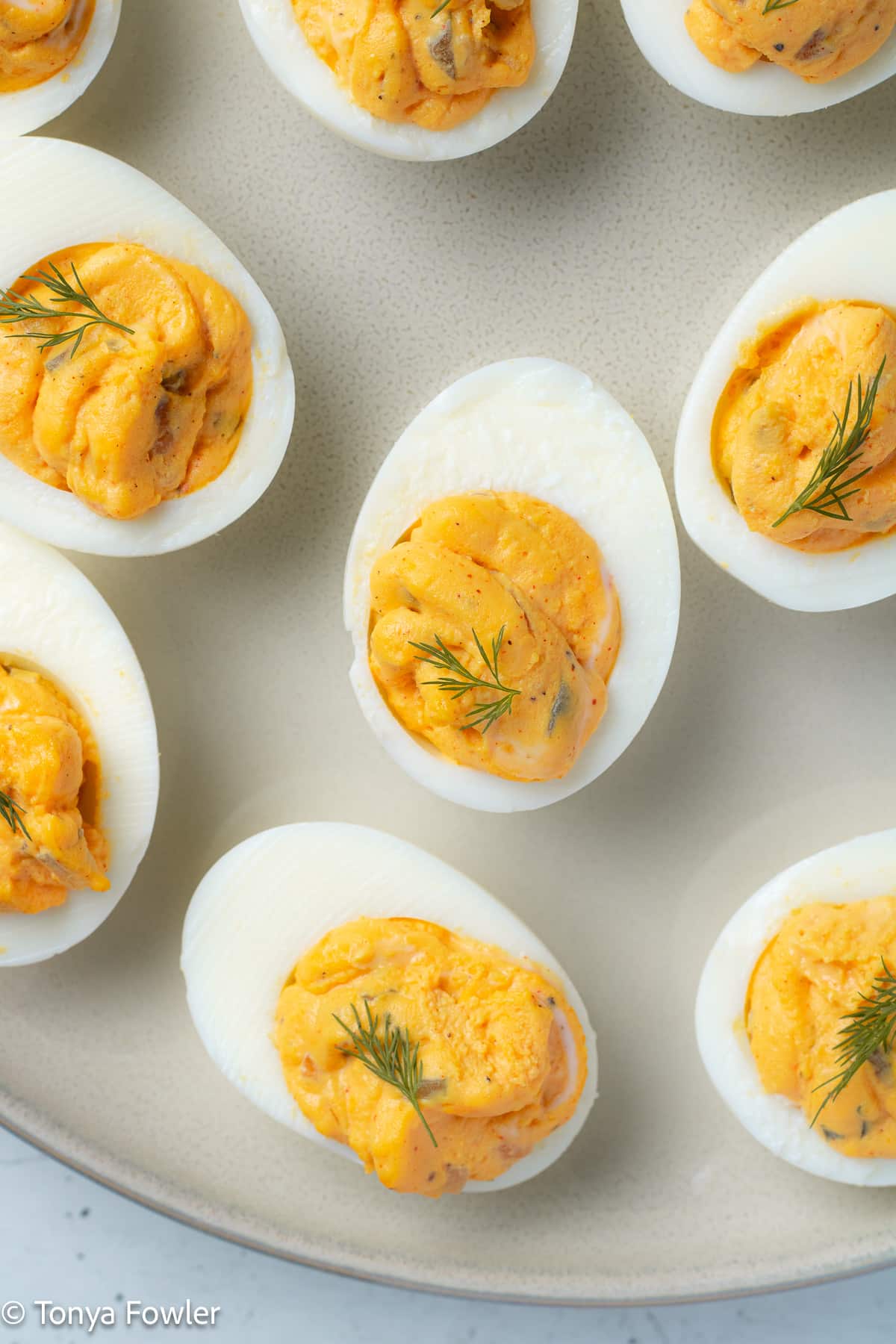 Overhead image of deviled eggs on a plate.
