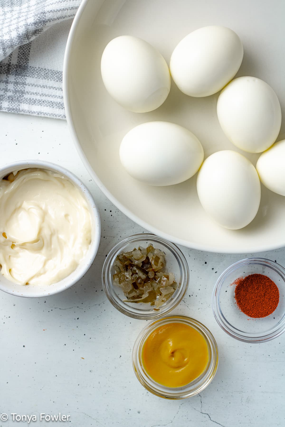 Deviled eggs ingredients on a table.