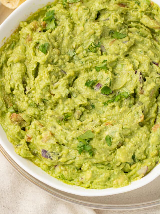 Close up image of guacamole in a bowl.